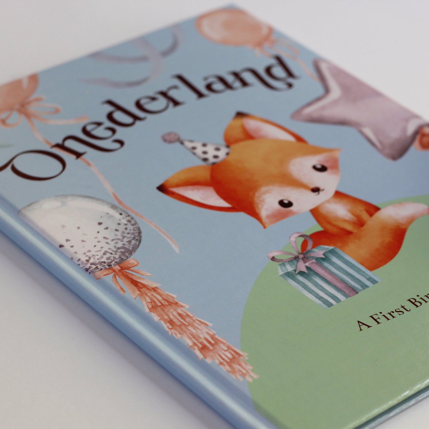 Children's picture book titled 'Onederland' with a fox illustration on a light blue background