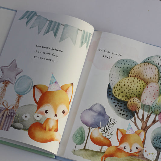 Open children's picture book Onederland with illustrations of foxes and colorful trees on a white background